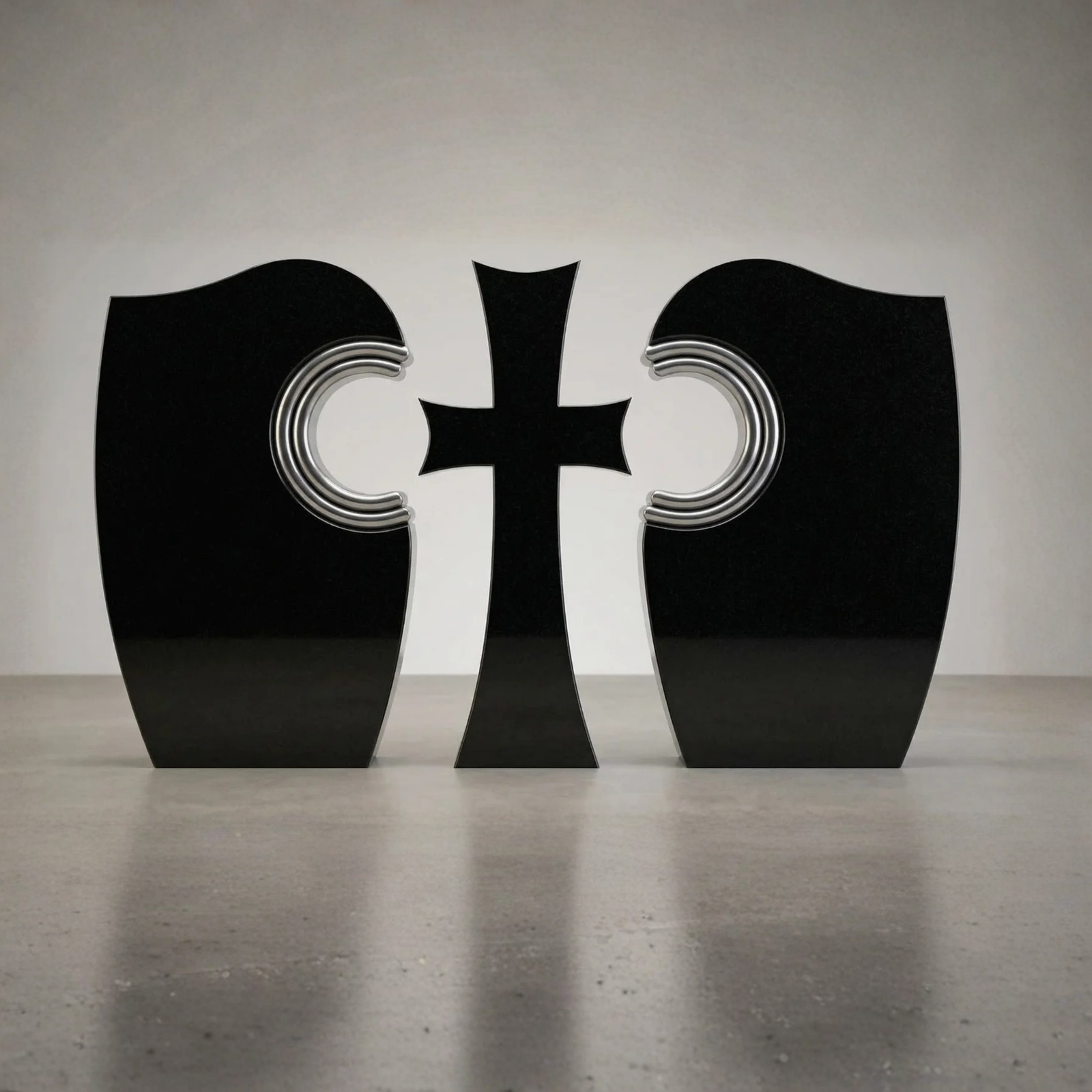 A modern, three-piece polished black granite memorial monument featuring a central stylized cross flanked by two symmetrical curved stones with silver-lined, semi-circular cutouts facing the center.