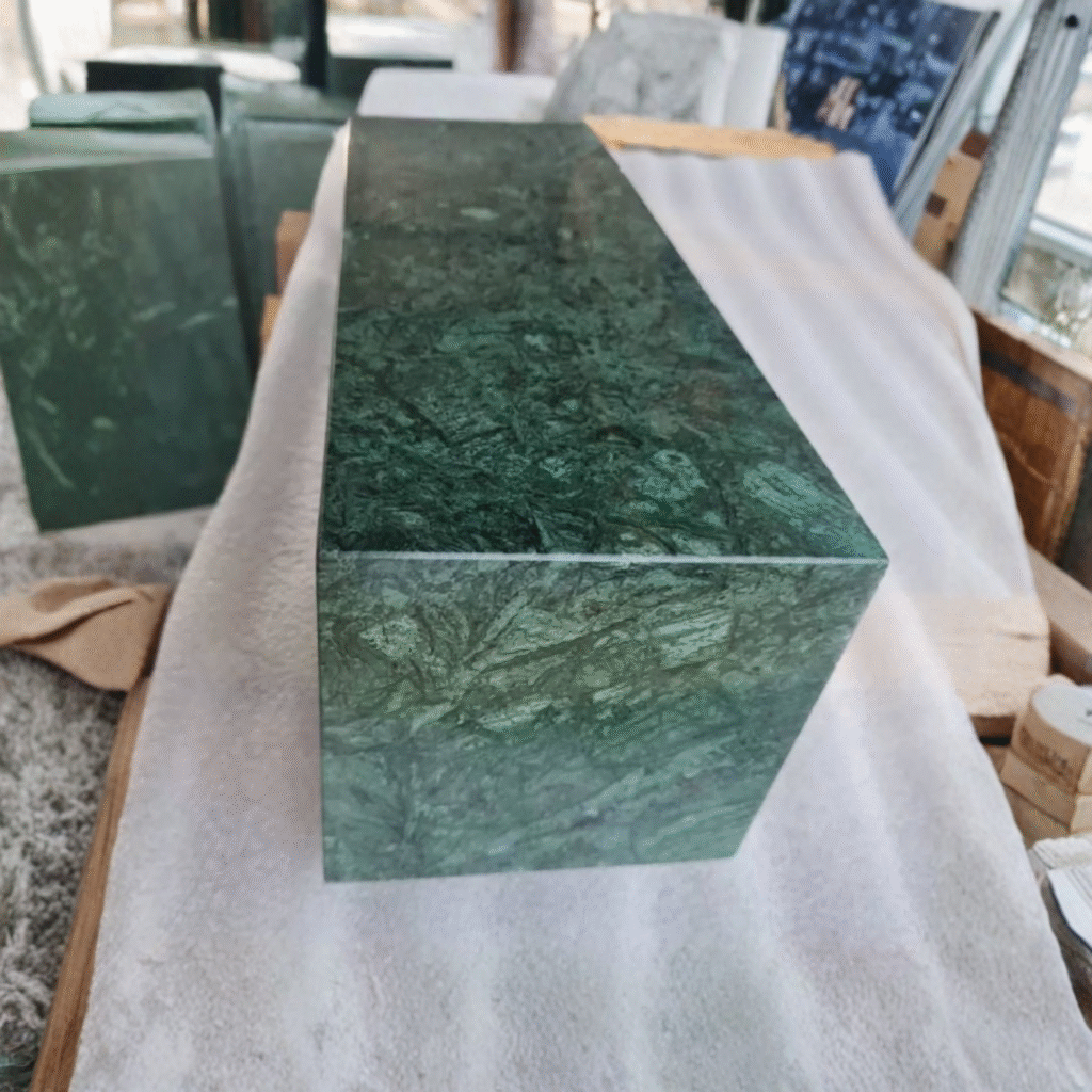 A solid rectangular block of highly polished Imperial Green natural stone, featuring beautiful forest-like veins, designed to be used as a premium monument base.