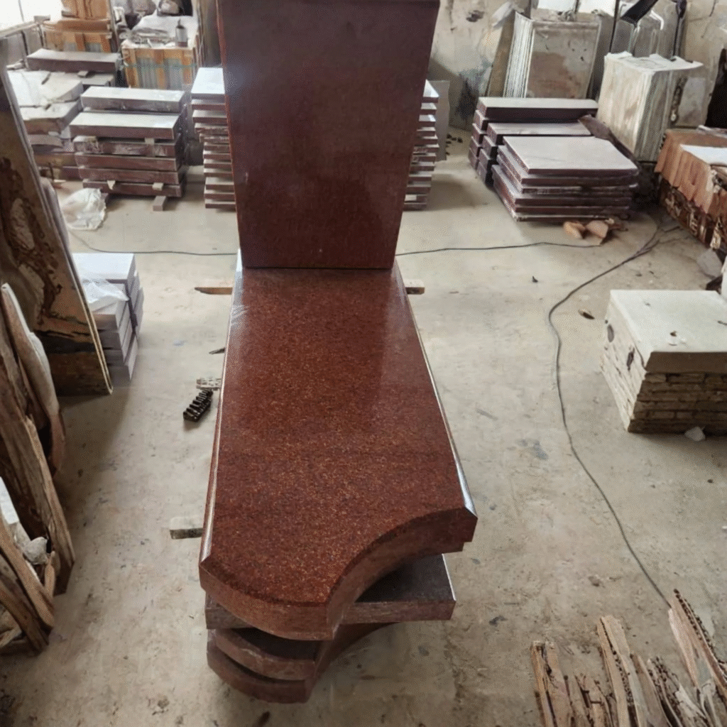 Highly polished Imperial Red Indian granite full grave ledger monument, featuring an upright headstone and a thick ledger slab with an elegant curved foot.